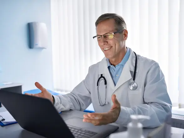Person completing a telehealth visit from home to get certified for FMLA leave